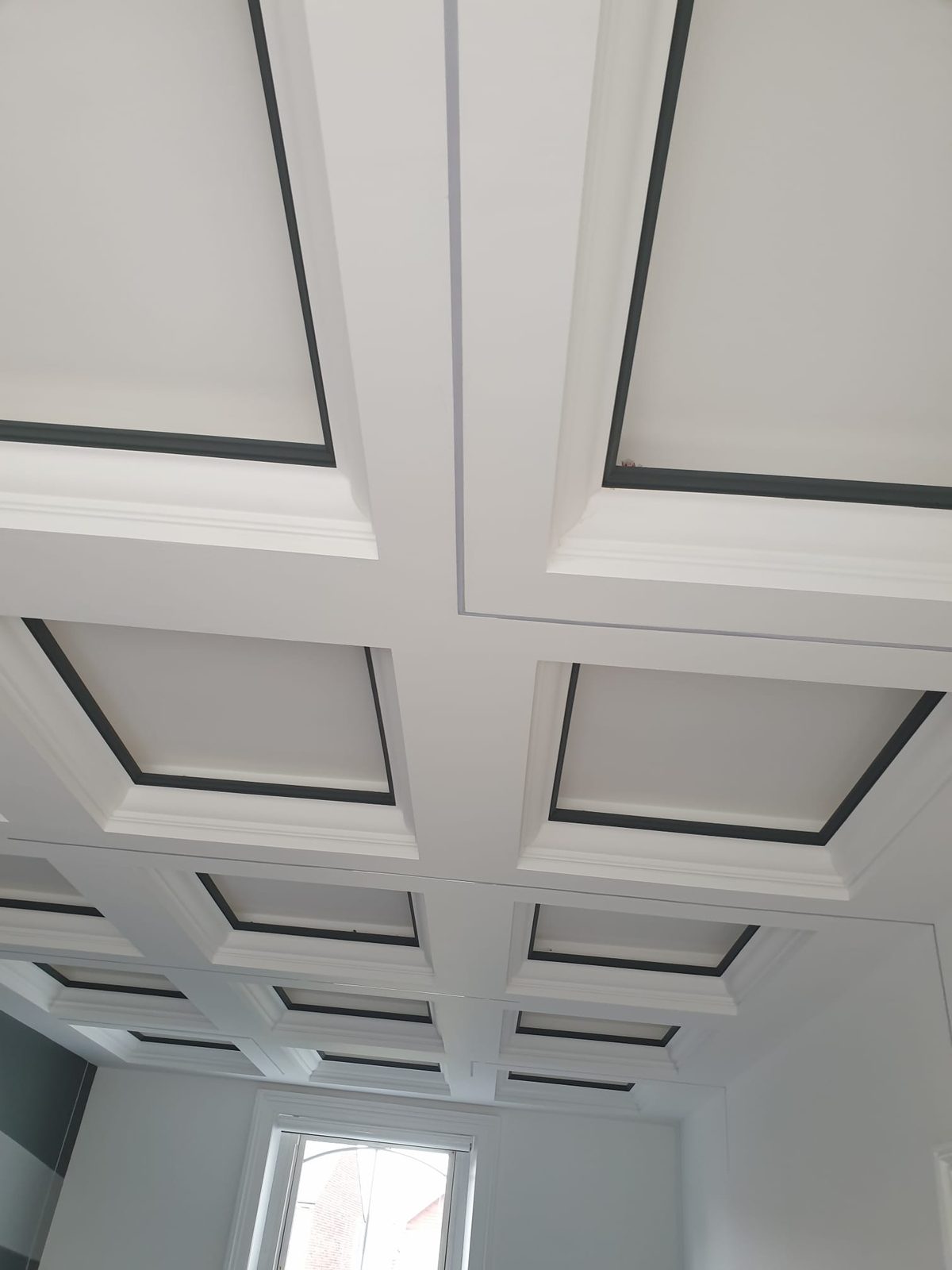 Coffered ceiling with recessed feature lighting